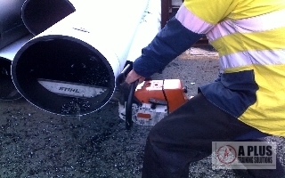Poly Welder Cutting Pipe with a Chainsaw